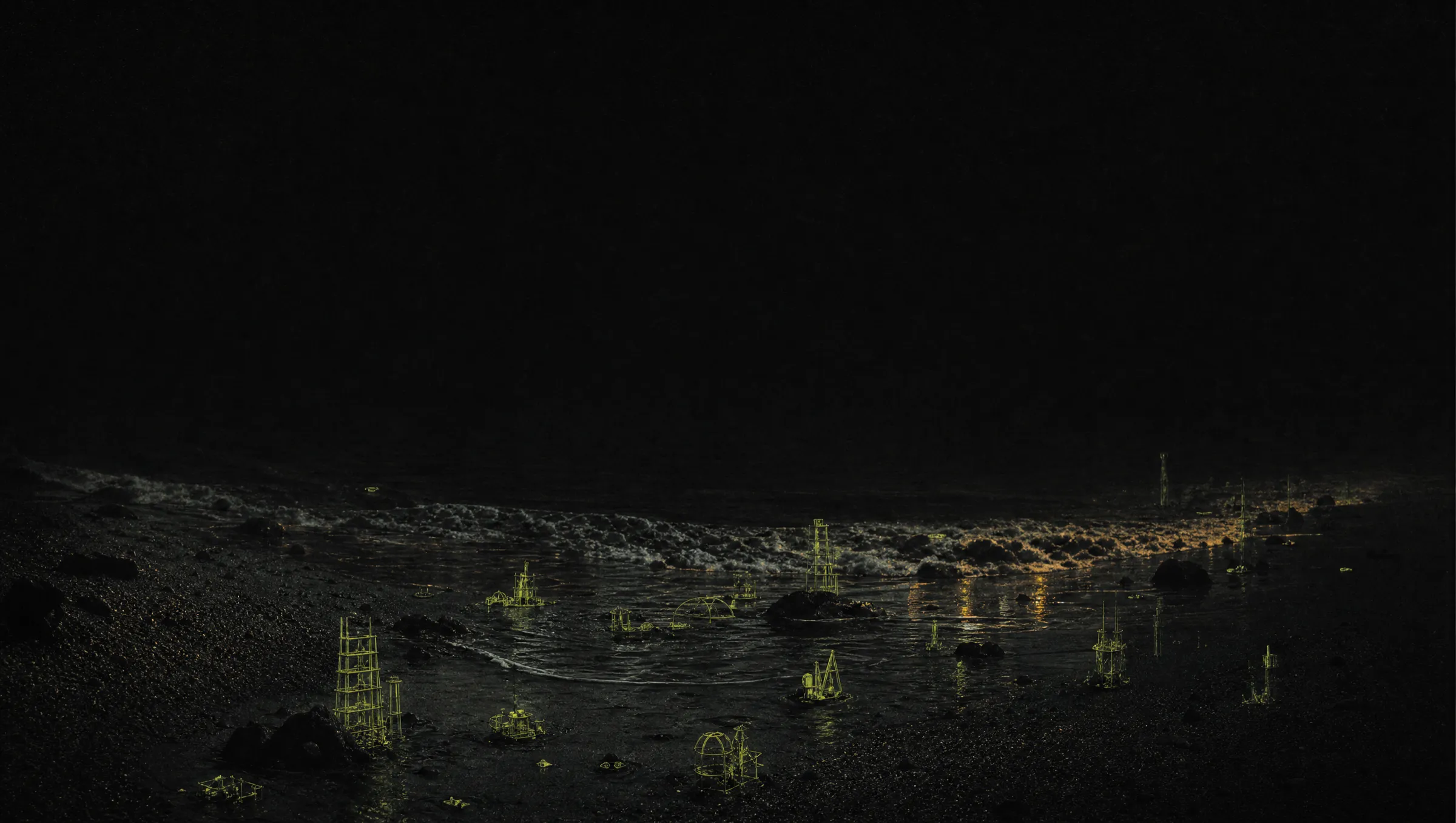 A dark receding wave on a black shore at night, leaving behind small glowing lime structures (scaffolds and machines) exposed on the wet sand.